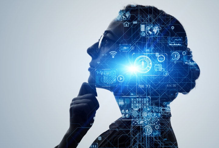 Image of a person with a computer and AI elements overlaying her silhouette.